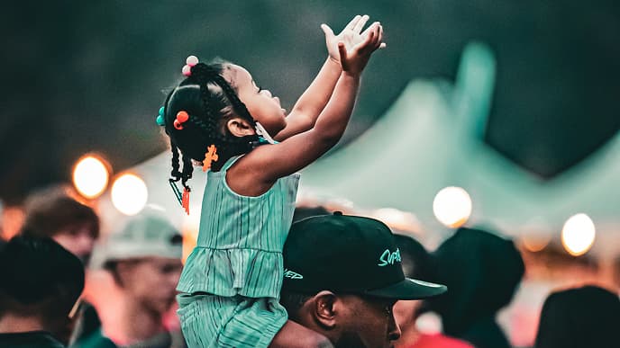 Child reaching for basketball