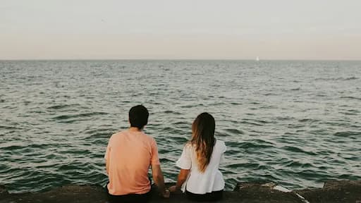 Couple looking at lake view