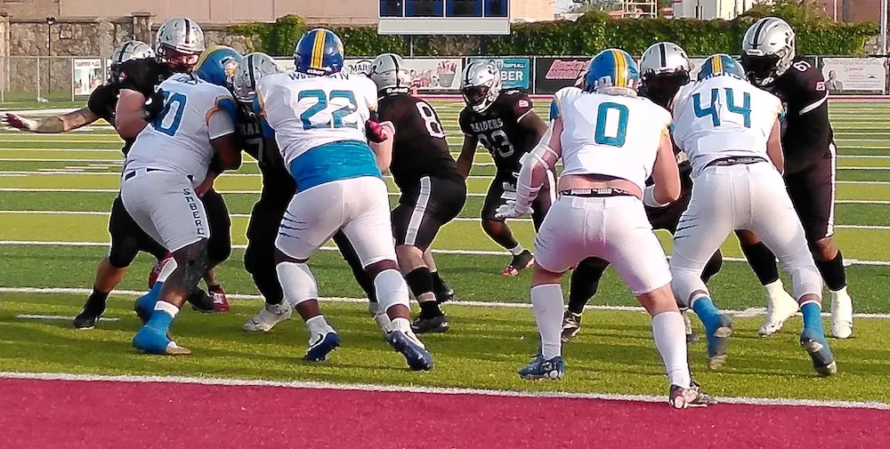 Racine Raiders stay undefeated on crucial interception